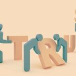 Stylized figures are assembling the word "TRUST" in a light pastel setting.