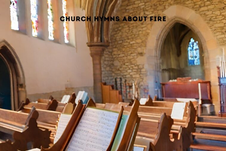 Inside a church, wooden pews with music stands face forward. Stained glass windows and stone walls are visible. Text overlay reads "CHURCH HYMNS ABOUT FIRE".