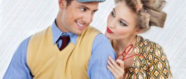 Retro-style image of a smiling man in a newsboy cap and sweater vest, with a woman in curlers and a patterned top looking at him, holding red glasses.